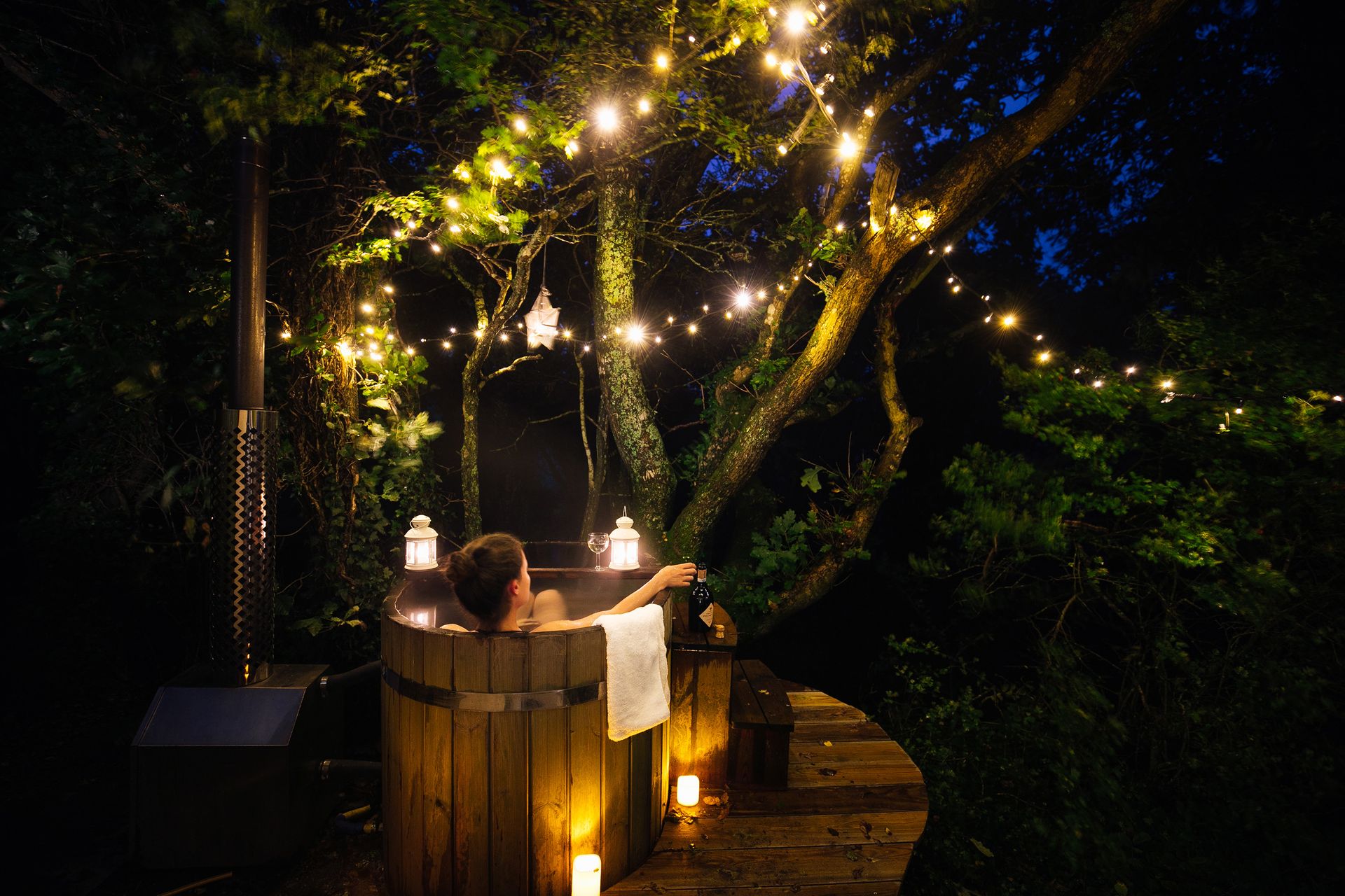 <p>                     Good garden lighting can be a real mood booster, so just imagine what happens when you combine them with a hot tub. An ultimate zen-out zone that can be enjoyed after dark, that's what.                   </p>                                      <p>                     It's always nice to light candles with your bath for a solo-pamper session, and you can do just the same outside. This beautiful example from Canopy & Stars uses a mixture of candles, lanterns, and star-shaped lights to transport guests straight into a fairytale.                   </p>                                      <p>                     And, although adding bubble bath is a definite no-no in hot tub dos and don'ts, there are aromatherapy products made especially for spas if you want to up the ambiance even more.                   </p>