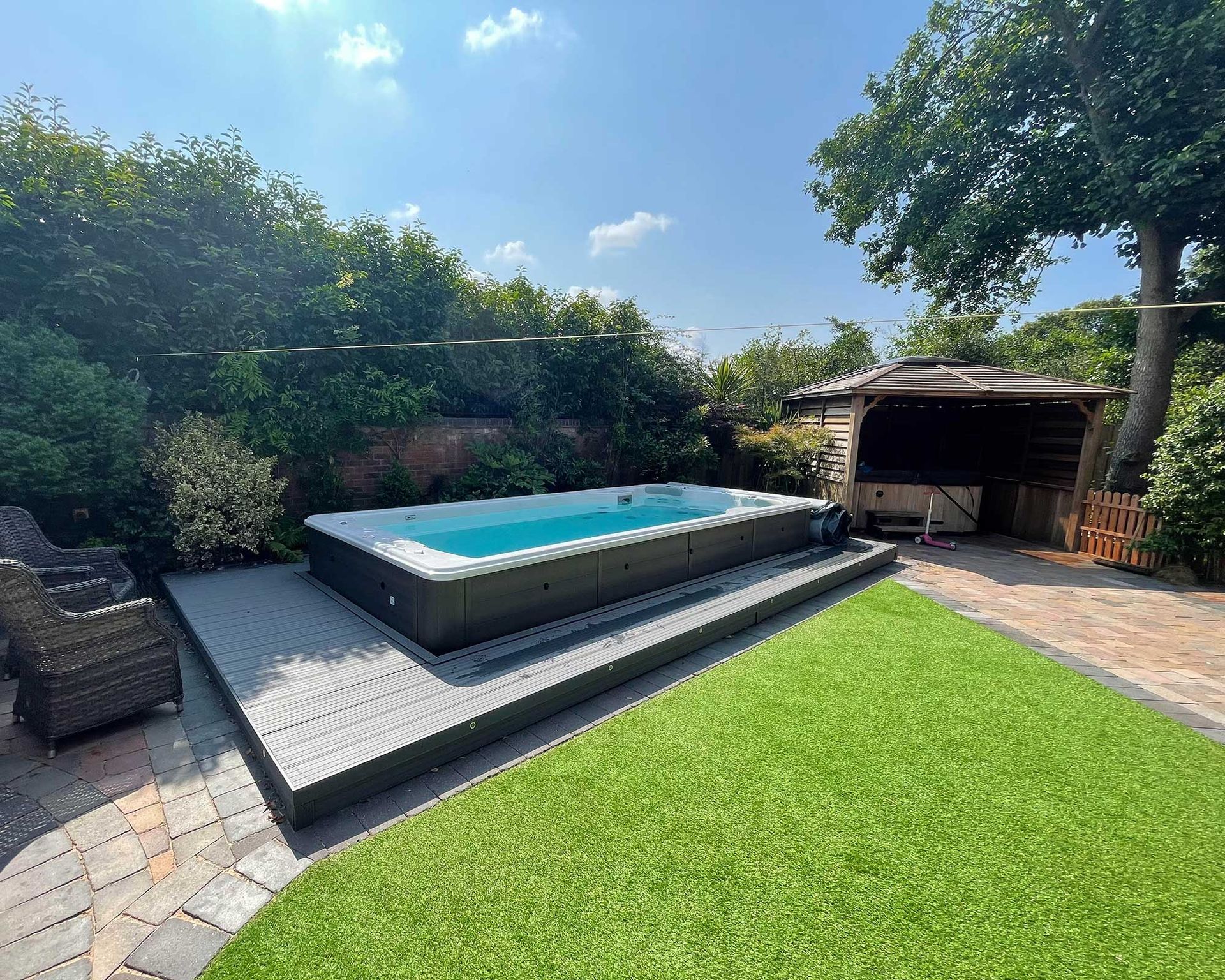 <p>                     If you love to entertain or are looking for family garden ideas for your backyard, then perhaps a swim spa is the solution.                   </p>                                      <p>                     Bigger than traditional hot tubs, these designs can facilitate both relaxation and exercise. There is still integrated seating, but also, they can be set to create a current, using a powerful jet, that can be used to swim or walk against as part of a workout regime.                   </p>                                      <p>                     Set atop a sleek deck, they make a fabulous feature for larger plots, without having to commit to a full-sized swimming pool.                   </p>