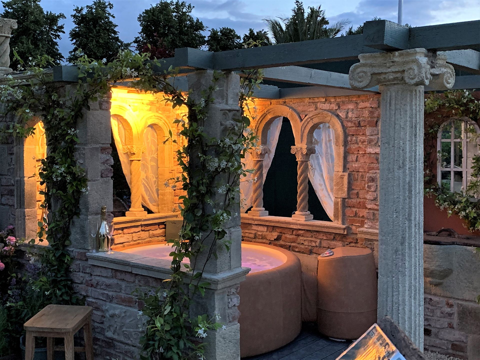 <p>                     Surrounding your spa with a garden folly is a surefire way to make a statement. With glorious arches and columns, you'll instantly be transported to a luxurious Roman-style spa. Billowing curtains and twirling tendrils of ivy all add to the drama, creating a stunning focal point for any garden.                   </p>                                      <p>                     It ticks the box if you're looking for hot tub privacy ideas, too. 'The extra benefit is that the owners also have screening, allowing them to enjoy their hot tub in private. What we can create can easily be retrofitted around an existing hot tub, or as part of a new scheme,' says Tim Redwood of Redwood Stone.                   </p>