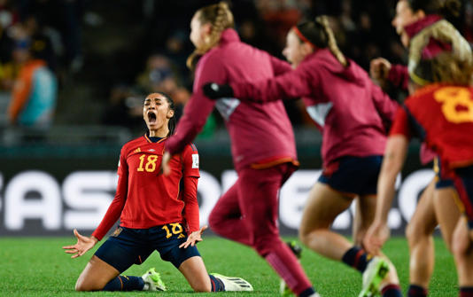 Spain's Salma Paralluelo celebrates as her teammates run onto the pitch after defeating Sweden in the Women's World Cup semifinal soccer match at Eden Park in Auckland, New Zealand,