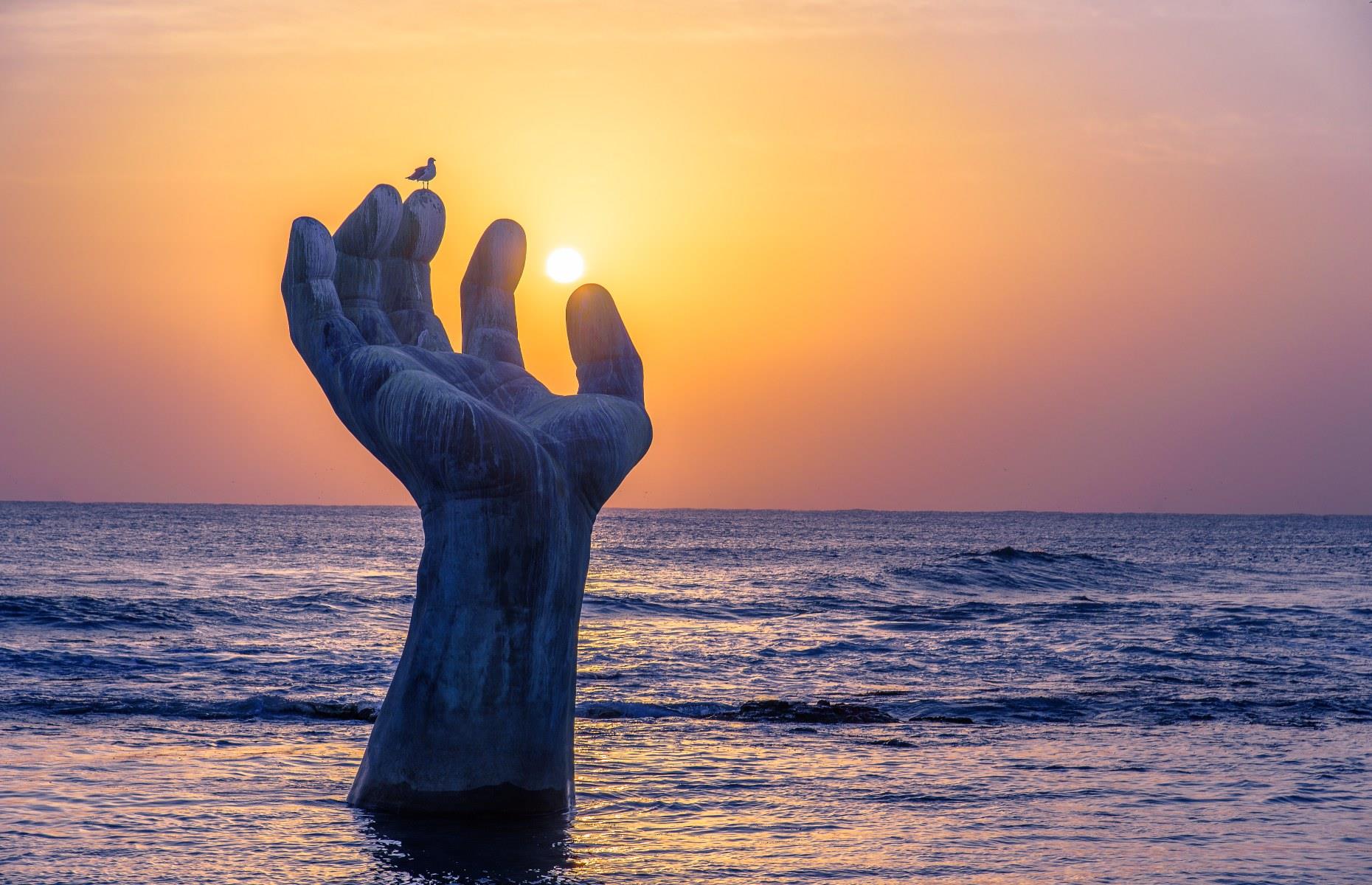 <p>You’ll find this striking bronze sculpture in Homigot, on Korea's easternmost tip, and it’s no coincidence that this town marks the location of South Korea’s earliest first sunrise every year. Early morning is certainly the most captivating time to visit to see the hand silhouetted against the sun. The right hand (pictured) emerges from the ocean, while the left hand is installed on the beachfront.</p>