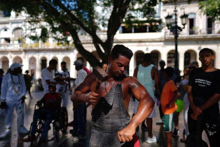 Cuba's 'Ironman' Lino Tomasen performs in downtown Havana, Cuba, on August 8. Reuters