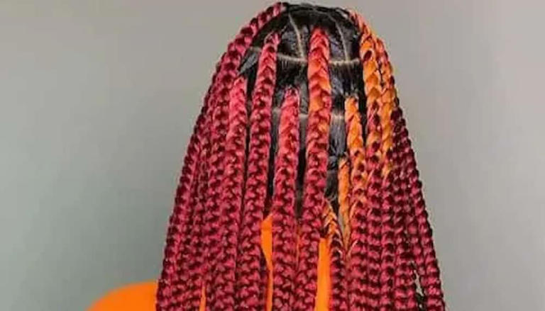 Thick burgundy knotless box braids. Photo: @cecebraidedit Source: Instagram