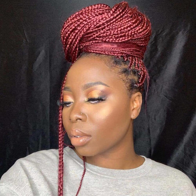 Chic updo burgundy knotless braids. Photo: @bibibeatz Source: Instagram