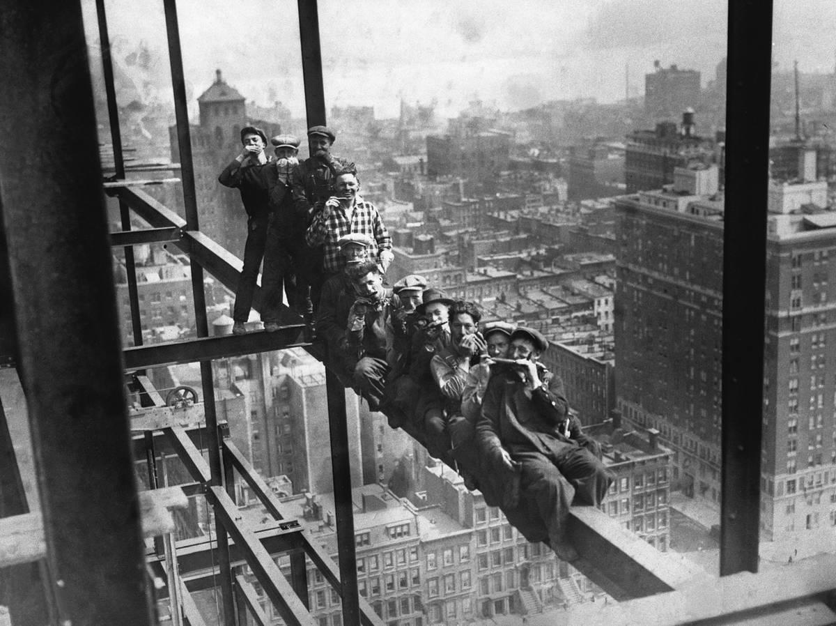 <p>This photo, taken in 1925, depicts a construction worker in New York City who decided to pull a daring stunt and walk on a construction girder twenty stories in the air while blindfolded. </p> <p>Cameras were also the hip, new thing back in those days, and workers decided to have fun by posing for wild photos in mid-air like this one. </p>