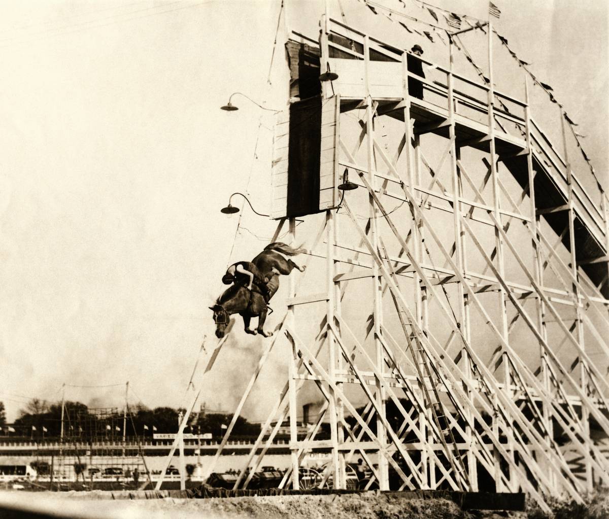 <p>These folks are gathered around to witness Eunice Winkless perform horse diving. In 1905, Winkless performed this stunt for a Fourth of July event. </p> <p>The stunt woman dove from a 50-foot-high tower into a small pool while on horseback.</p> <p><a href="https://www.msn.com/en-us/community/channel/vid-rm8gb6502735hjr5kwws5apergf2ehaxhx4n7c4eyc5yhkkkapya?item=flights%3Aprg-tipsubsc-v1a&ocid=windirect&cvid=89e366c9b4094002b65f4a70a655c93d" rel="noopener noreferrer">Follow us for more great content</a></p>