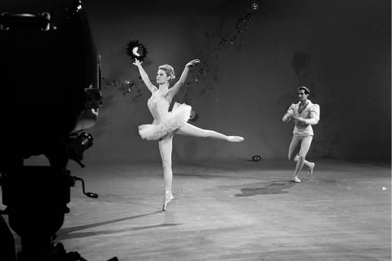 <p>Growing up, French actress Brigitte Bardot had her eyes set on becoming a professional ballerina. Ultimately, she went into modeling and acting instead of dancing, but continued to land roles in which her character would gracefully, or not so gracefully, twirl around the stage.</p> <p>The black and white photograph shows Bardot and her dance partner Michel Renaud warming up and stretching before their performance on a French program called <i>TV Variety Shows</i>. </p>