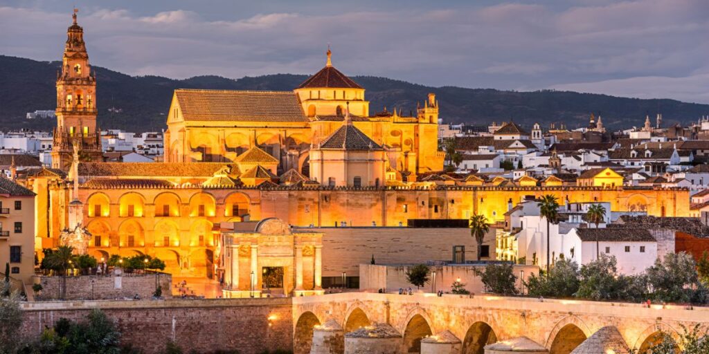 <p>When someone mentions Cordoba, the first image that comes to mind is Mezquita de Cordoba, its Mosque-Cathedral, and it is undoubtedly the most emblematic building in the city.</p><p>Its Mosque-Cathedral is a UNESCO World Heritage Site and a building with lots of history behind it. One of the reasons it is so important is the representation of different religions.</p><p>Other important locations across Cordoba are Alcazar de los Reyes Cristianos and the historic center, home to several museums and Cordoba’s Synagogue.</p><p>If you are planning a visit to Cordoba, the best time to visit it is spring, especially in May, when you can attend its courtyard festival, where locals decorate their patios with beautiful flower pots and other decorations. Not only are they aesthetically pleasing, but they tell a story.</p>