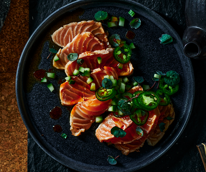 This salmon tataki recipe is made with grilled salmon and served with a lime and jalapeño ponzu. It's a fast and flavour-packed starter or side dish.