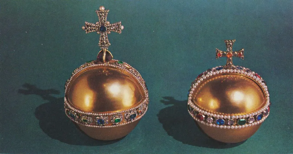 <p>The solid gold piece on the left is called the <a href="https://www.rct.uk/collection/themes/trails/the-crown-jewels/the-sovereigns-orb" rel="noopener noreferrer">Sovereign's Orb</a>, which is part of the royal family's coronation regalia. It was initially made for the 1661 coronation of Charles II.</p> <p>The impressive orb contains more than 600 gems and pearls, including diamonds, rubies, sapphires, emeralds, and amethyst. The orb on the right was made for Queen Mary in 1689.</p>
