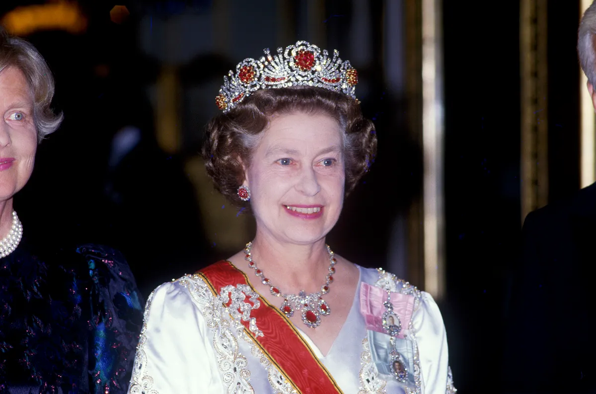 <p>Taking a page from Queen Mary and her mother, Queen Elizabeth II had this tiara made from gems she received as presents from the People of Burma for her wedding to Prince Philip. In 1973 she commissioned the House of Garrard to create the <a href="https://www.thecourtjeweller.com/2017/04/the-burmese-ruby-tiara.html" rel="noopener noreferrer">Burmese Ruby tiara</a> out of rubies and diamonds from a dismantled tiara given to her by the Nizam of Hyderabad.</p> <p>The Burmese Ruby tiara features multiple Tudor rose designs and totals 96 rubies. The Burmese people believe that rubies help protect the wearer from the 96 diseases that can afflict the human body.</p>
