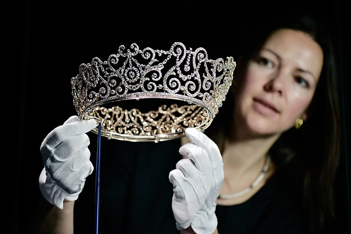 <p>The <a href="https://www.rct.uk/collection/themes/exhibitions/diamonds-a-jubilee-celebration/buckingham-palace/delhi-durbar-tiara" rel="noopener noreferrer">Delhi Durbar Tiara</a> was originally made for Queen Mary in 1911. It was made by Garrard for a celebration in Delhi that marked the coronation of King George V and Queen Mary as Emperor and Empress of India. </p> <p> Mary had this tiara made with remnants of another tiara set in platinum and gold. It used to have ten cabochon emerald drops on top, but these were later repurposed into a different tiara.</p>