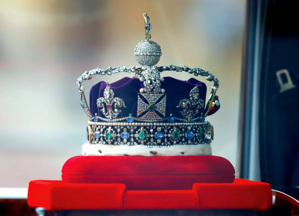 <p>The <a href="https://www.rct.uk/collection/31701/the-imperial-state-crown" rel="noopener noreferrer">Imperial State Crown</a> is really something. It was made for the coronation of King George VI in 1937 and is set with 2,868 diamonds, 17 sapphires (the largest being 104 carats), 11 emeralds, and 269 pearls upon a purple velvet cap with an ermine band.</p> <p>The largest stone on the crown is called Cullinan II, or the "Second Star of Africa", and weighs a jaw-dropping 317.4 carats. Traditionally worn by the monarch for his or her coronation, it was adjusted to fit Queen Elizabeth II when she took the throne in 1953.</p>