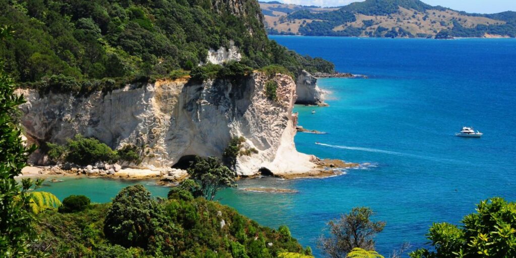 <p>New Zealand’s North Island has many incredible beaches, many of which can be found on the Coromandel Peninsula.</p><p>Two of the best <a href="https://weekendpath.com/the-most-beautiful-beaches-in-the-coromandel/" rel="noreferrer noopener">beaches in the Coromandel</a> are Cathedral Cove and Hot Water Beach, both major attractions.</p><p>Cathedral Cove is known for its grandiose rock archway and sandy white beach. To access Cathedral Cove, there are options to take a <a href="https://viator.tp.st/NYq4MNVk" rel="noreferrer noopener nofollow sponsored">scenic boat tour</a>, <a href="https://viator.tp.st/yq6DsDZ4" rel="noreferrer noopener nofollow sponsored">kayak tour</a>, or water taxi.</p><p>At Hot Water Beach, you can dig your own hot tub in the sand at low tide! Geothermal waters bubble up from beneath the beach, and you only need a shovel and some energy to carve out your own hot pool. You can rent shovels from a shop right next to Hot Water Beach. This is undoubtedly one of the most unique things to do on the North Island! </p><p>The Coromandel has some great accommodation options, but one of the best ways to experience the area is to go camping at one of the many awesome beachfront campgrounds in the Coromandel.</p>