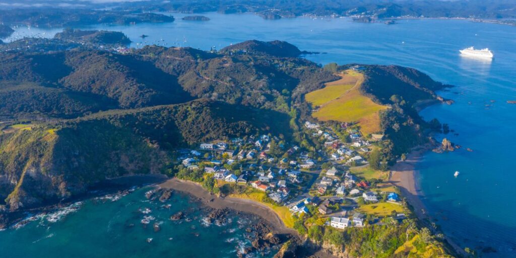 <p>A 3-hour drive north of Auckland leads you to the Bay of Islands, a subtropical district in the Northland region filled with beaches, history, and beautiful coastal scenery. </p><p>The main towns in the Bay of Islands are Paihia, Russell, and Kerikeri, which make a great home base for exploring the area. In addition to numerous accommodation options, you’ll also find some of <a href="https://weekendpath.com/northland-campgrounds/">Northland’s best campsites</a> in the Bay of Islands. </p><p>While in the Bay of Islands, <a href="https://viator.tp.st/tKX94a3l" rel="noreferrer noopener nofollow sponsored">book a scenic cruise</a> to spot marine life and experience some of the 144 islands that give this district its name. You can also charter a boat to go ocean fishing, which the area is well-known for.</p><p>The Waitangi Treaty Grounds are an important historic and cultural site in New Zealand and a must-visit in the Bay of Islands.</p><p>Active travelers will also love the hiking, diving, and snorkeling opportunities around the Bay of Islands. </p><p>Some excellent day trips from the Bay of Islands include <a href="https://viator.tp.st/GS5u6n0k" rel="noreferrer noopener nofollow sponsored">visiting Cape Reinga</a> at the top of the North Island and viewing ancient kauri trees in the Waipoua Forest.</p>