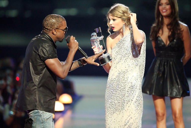 Kanye West jumps on stage after Taylor Swift won the Best Female Video award during the 2009 MTV Video Music Awards at Radio City Music Hall on Sept. 13, 2009, in New York City.