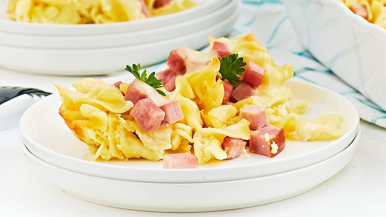 <p>Our family loves this quick, easy, hearty Ham and Noodle Casserole (German: Nudelauflauf mit Schincken). Tender pasta is topped with a simple egg and cream sauce and finished with Swiss cheese.</p><p><strong>Get the Recipe: <a href="https://cheerfulcook.com/german-ham-and-noodle-casserole/" rel="noreferrer noopener">Ham And Noodle Casserole</a></strong></p>