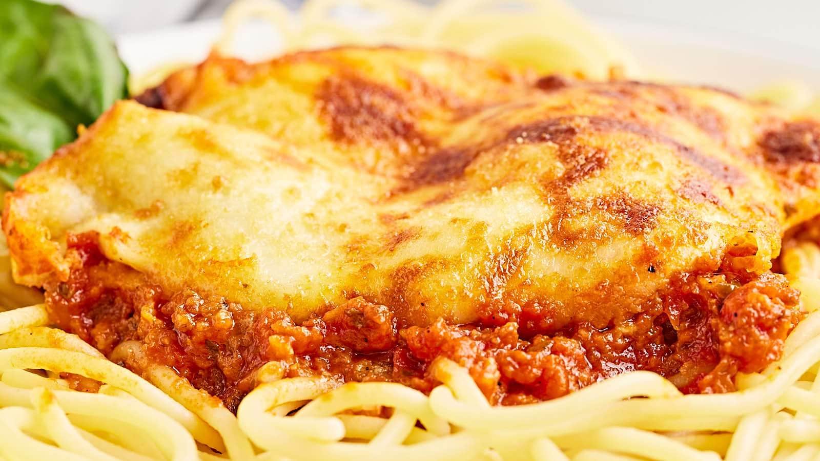 <p>Find out why thousands of readers have made this recipe and love it! If you are looking for a delicious and easy-to-make dinner the whole family will love, our Chicken Parmesan recipe is for you! Juicy, tender, and crispy breaded chicken is baked to perfection in flavorful tomato sauce and topped with mozzarella and parmesan cheese!</p><p><strong>Get the Recipe: <a href="https://cheerfulcook.com/easy-cheesy-chicken-parmesan-recipe/" rel="noreferrer noopener">Chicken Parmesan</a></strong></p>