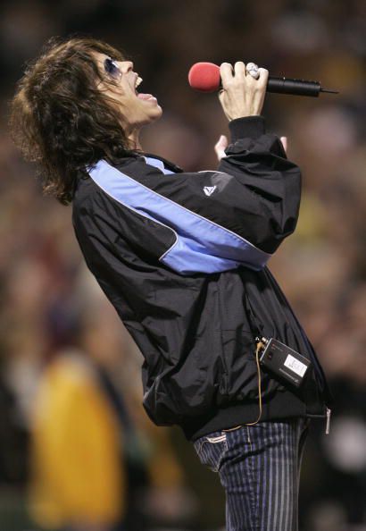 BOSTON - OCTOBER 23: Steven Tyler of Aerosmith sings the National Anthem before game one of the World Series between the Boston Red Sox and the St. Louis Cardinals on October 23, 2004 at Fenway Park in Boston, Massachusetts. (Photo by Elsa/Getty Images)