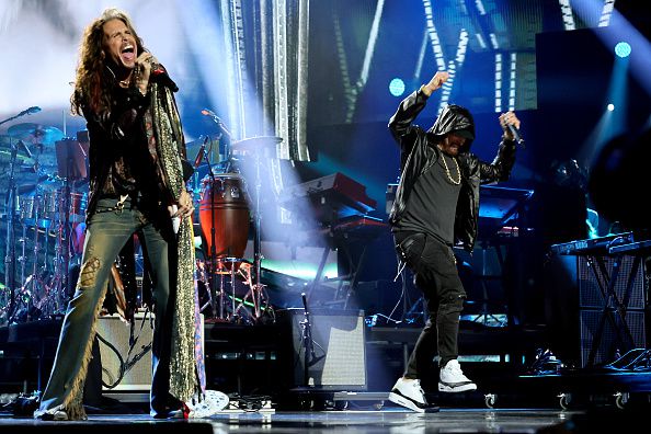 LOS ANGELES, CALIFORNIA - NOVEMBER 05: Steven Tyler and inductee Eminem perform onstage during the 37th Annual Rock & Roll Hall of Fame Induction Ceremony at Microsoft Theater on November 05, 2022 in Los Angeles, California. (Photo by Theo Wargo/Getty Images for The Rock and Roll Hall of Fame)