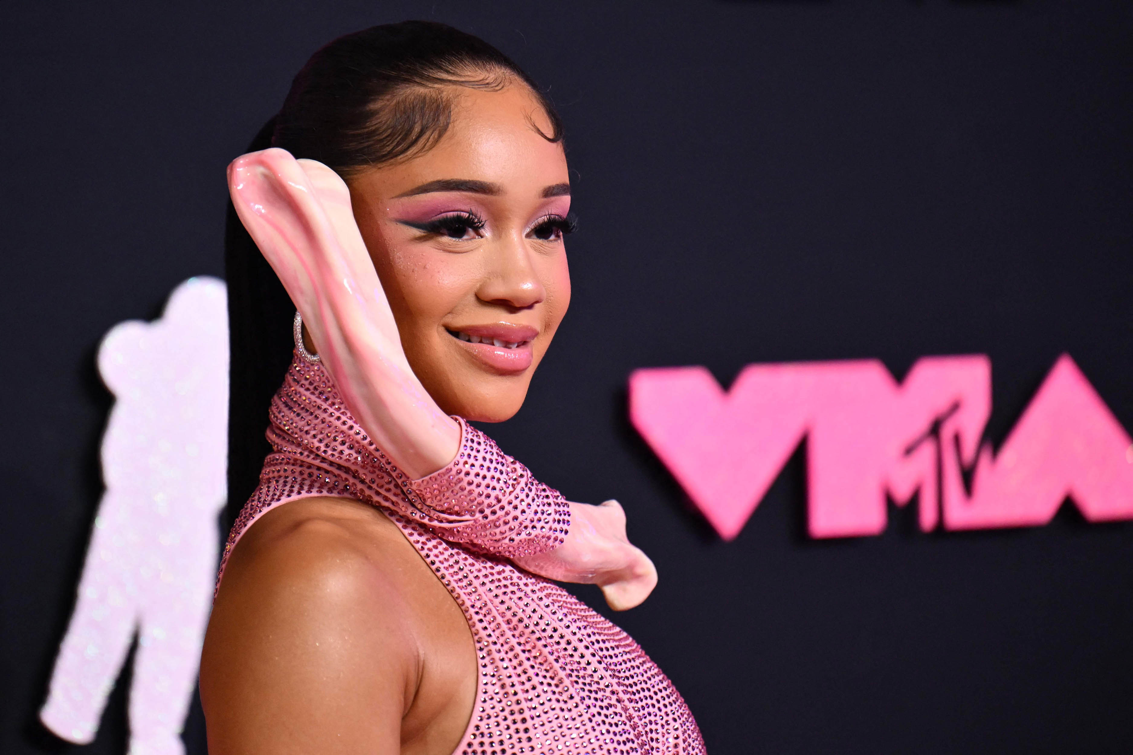Why does Saweetie’s dress to the VMAs have a bone in it?