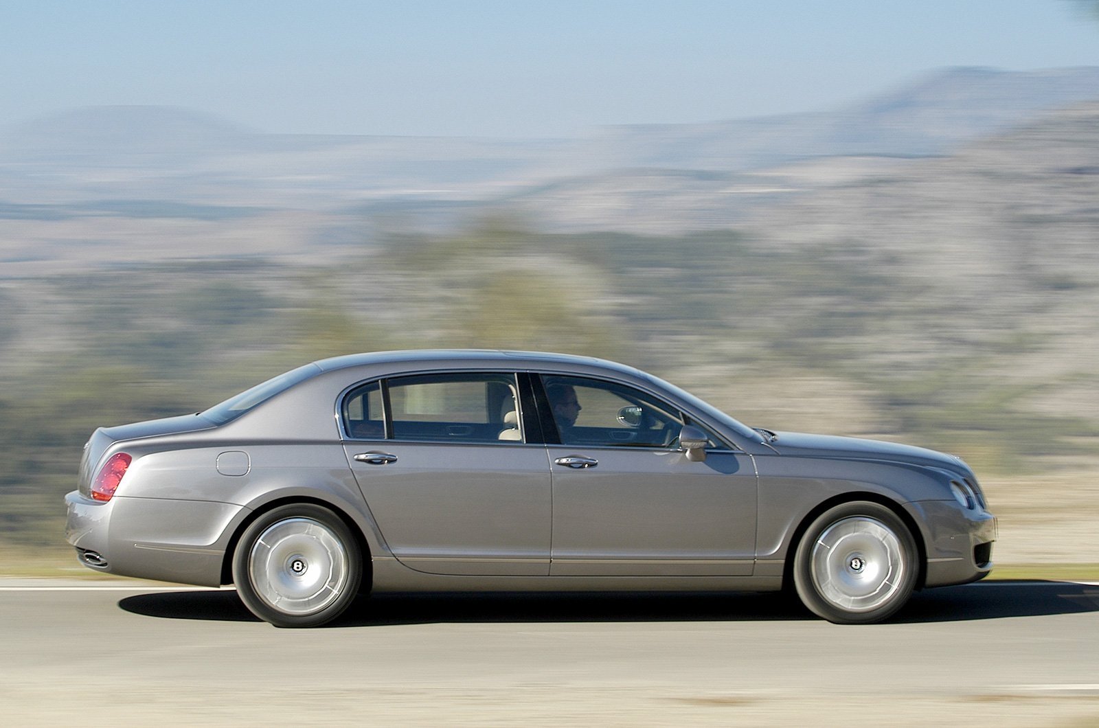 <p>In period we took a <strong>Bentley Continental Flying Spur </strong>to <strong>206mph</strong>, four-up with the air-con on, to prove that this was perhaps the world's greatest grand tourer. Effectively a four-door sedan version of the Continental GT, the Flying Spur featured a longer wheelbase than the coupe to ensure that people more than three feet tall could be carried in the back seats.</p>