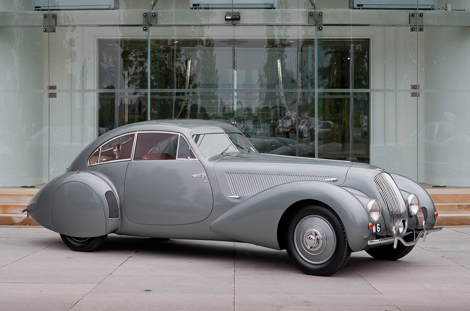 <p>In 1938, <strong>André Embiricos</strong>, a wealthy Greek racing driver living in Paris, commissioned a Bentley <strong>4 1/4-Litre </strong>with a sleek, aerodynamic body made from Duralumin, a lightweight aluminum alloy. This grand tourer was fast (it hit <strong>114mph </strong>over an hour at Brooklands) while also being civilized enough to despatch continental jaunts with ease.</p><p>This model was of great long term consequence for the company as both its design and essential ethos are seen as key influences on the <strong>Continental GT</strong>, the first Bentley to emerge under <strong>Volkswagen </strong>ownership in 2003.</p>