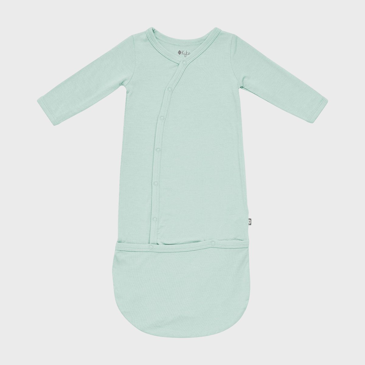 <p>The latest arrival may already have a closet full of adorable outfits, but those first days home are all about ease and comfort. Like everything Kyte Baby makes, this <a href="https://kytebaby.com/products/bundler-in-sage" rel="noopener noreferrer">sleep gown</a> is buttery soft and easy to get on and off. Unlike traditional sleep gowns, this bundler ensures that the baby's feet stay tucked in and toasty.</p> <p>When it's time for a diaper change, parents just have to unsnap the bundle and flip it back for easy access. The smallest sizes have fold-over cuffs to prevent scratches. Pair with a <a href="https://kytebaby.com/products/knotted-cap-in-sage" rel="noopener noreferrer">matching cap</a> for one of the most adorable and useful baby gifts. Not sure what size to buy? Here are some <a href="https://www.rd.com/article/top-tips-for-buying-baby-clothes/" rel="noopener noreferrer">top tips for buying baby clothes</a>.</p> <p class="listicle-page__cta-button-shop"><a class="shop-btn" href="https://kytebaby.com/products/bundler-in-sage">Shop Now</a></p>