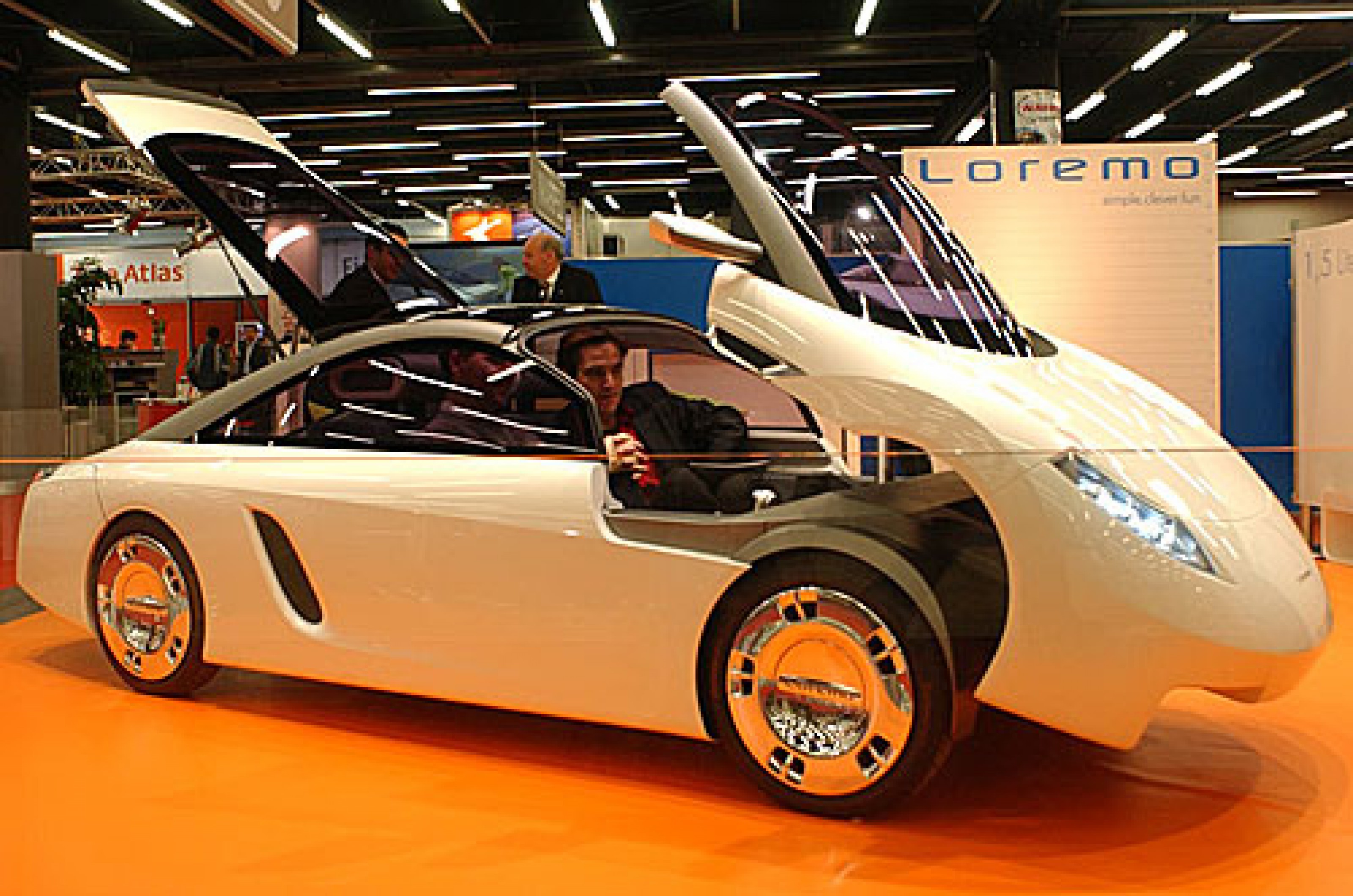 <p>Describing the entry point of the Loremo LS as a door feels like an insufficient term.</p>  <p>Its smooth lines were achieved with an intriguing absence of conventional doors. Instead, the front of the car’s bodywork, including the windshield, tips forward like a clamshell hood to reveal enough of an opening to clamber inside.</p>  <p>The concept likely stems from the company’s ethos ingrained in the name Loremo, which stands for Low Resistance Mobility.</p>  <p>Fewer seams for door panels marginally reduce drag and improve aerodynamics. And weight saving and streamline-design measures weren’t just for aesthetics – the company claimed the turbodiesel engine would deliver 157mpg.</p>  <p>Even more bizarrely, this LS is a 2+2 with rearward-facing back seats which are accessible via a trunk-like opening.</p>