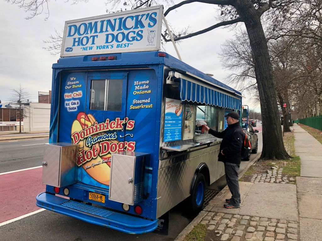 <p>There's no shortage of amazing hot dog stands in NYC, but if you have the time, make the trip to Queens for the amazing franks at <a href="https://www.yelp.com/biz/dominicks-hot-dog-truck-new-york">Dominick's Hot Dogs</a>. Try a dog piled high with sauerkraut or onions, or you could go all out with their incredible chili dog if you want spice.</p>