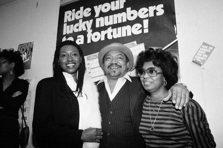 Curtis Sharp Jr. joins his wife, Barbara and girlfriend Jacqueline Bernabela to collect the winnings