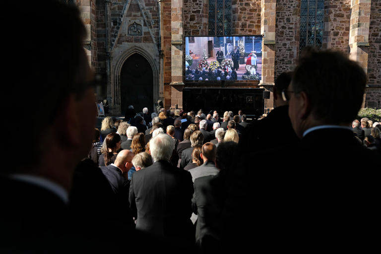 Mourners attend the memorial service of assassinated German politician Walter Lübcke in 2019. The assassination prompted Germany to crack down on online hate speech.
