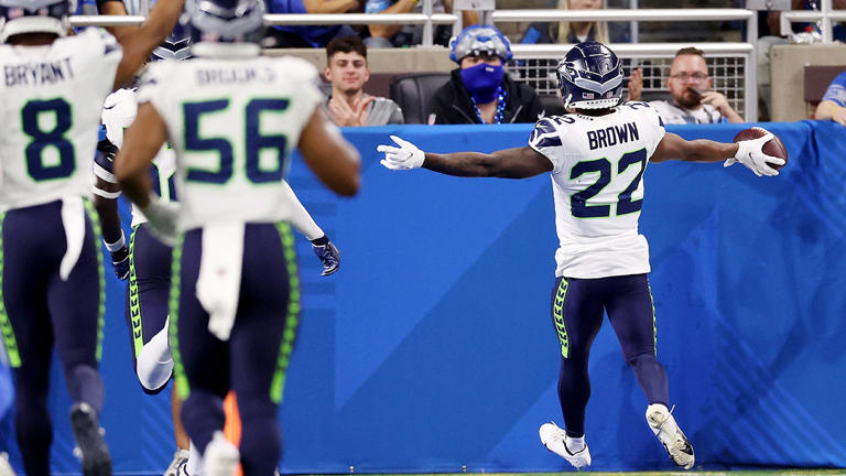 Tre Brown of the Seattle Seahawks returns an interception for a touchdown during the fourth quarter against the Lions at Ford Field in Detroit on September 17, 2023. Gregory Shamus/Getty Images