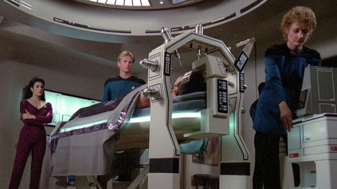 <p><span>Riker’s return from an away mission in “Star Trek: The Next Generation” sees him infected with alien microbes, rendering him comatose. Dr. Pulaski faces a dilemma: killing the microbes would likely kill Riker, too. </span><span>Racing against time, she triggers his neural impulses, prompting Riker to reflect on past Enterprise experiences. The revelation that negative emotions can vanquish the invaders offers hope for his recovery.</span></p><p><strong><span>Source</span></strong><span>: </span><a class="editor-rtfLink" href="https://www.imdb.com/list/ls077686245/" rel="noopener"><strong><span>IMDB</span></strong></a><span>.</span></p>