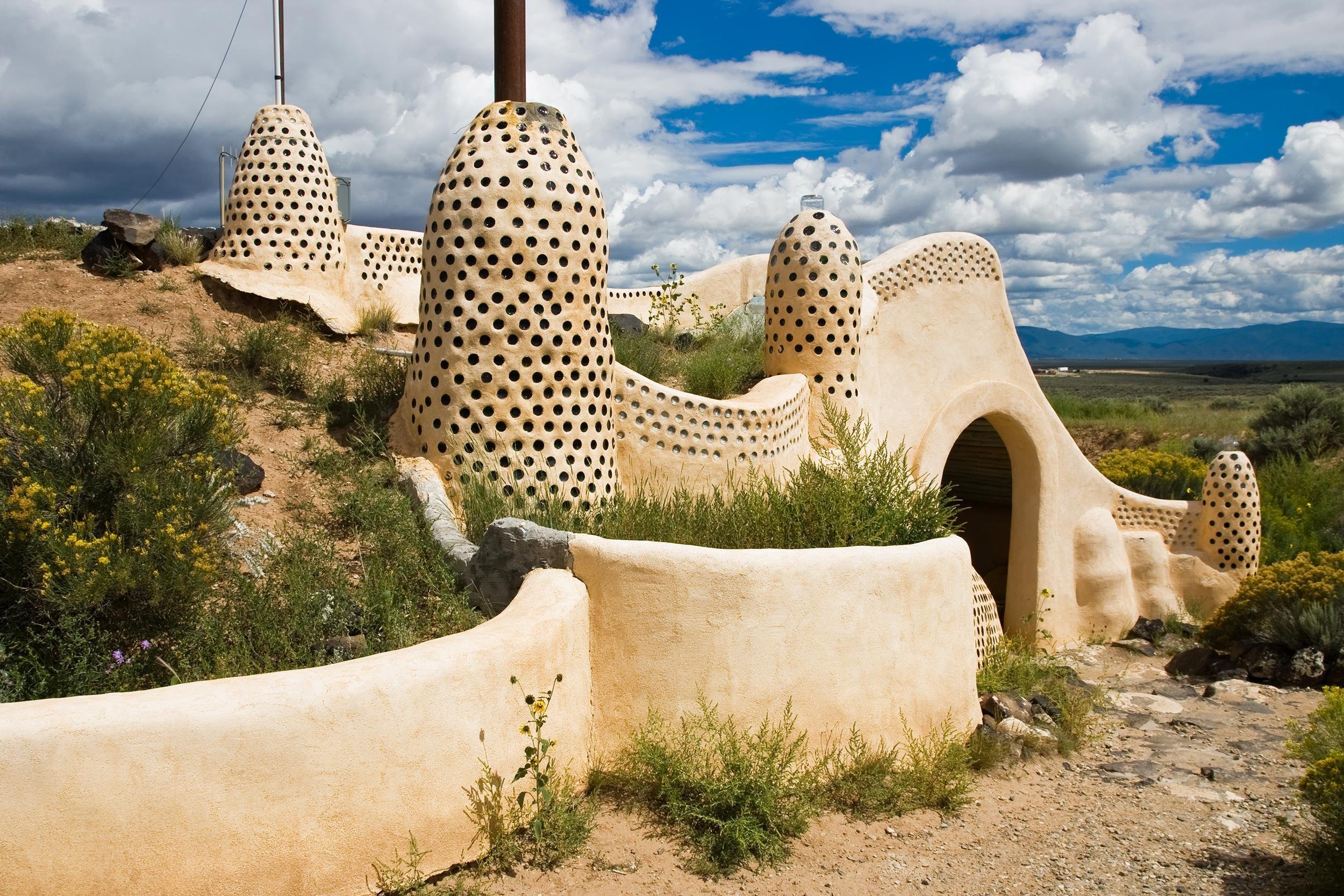 <p>Taos is home to unique and eerily beautiful "biotecture" edifices called Earthships. The self-sustaining and built-by-hand structures are marked with impressive mosaics, stained-glass windows, and architecture unlike most anywhere else. </p>