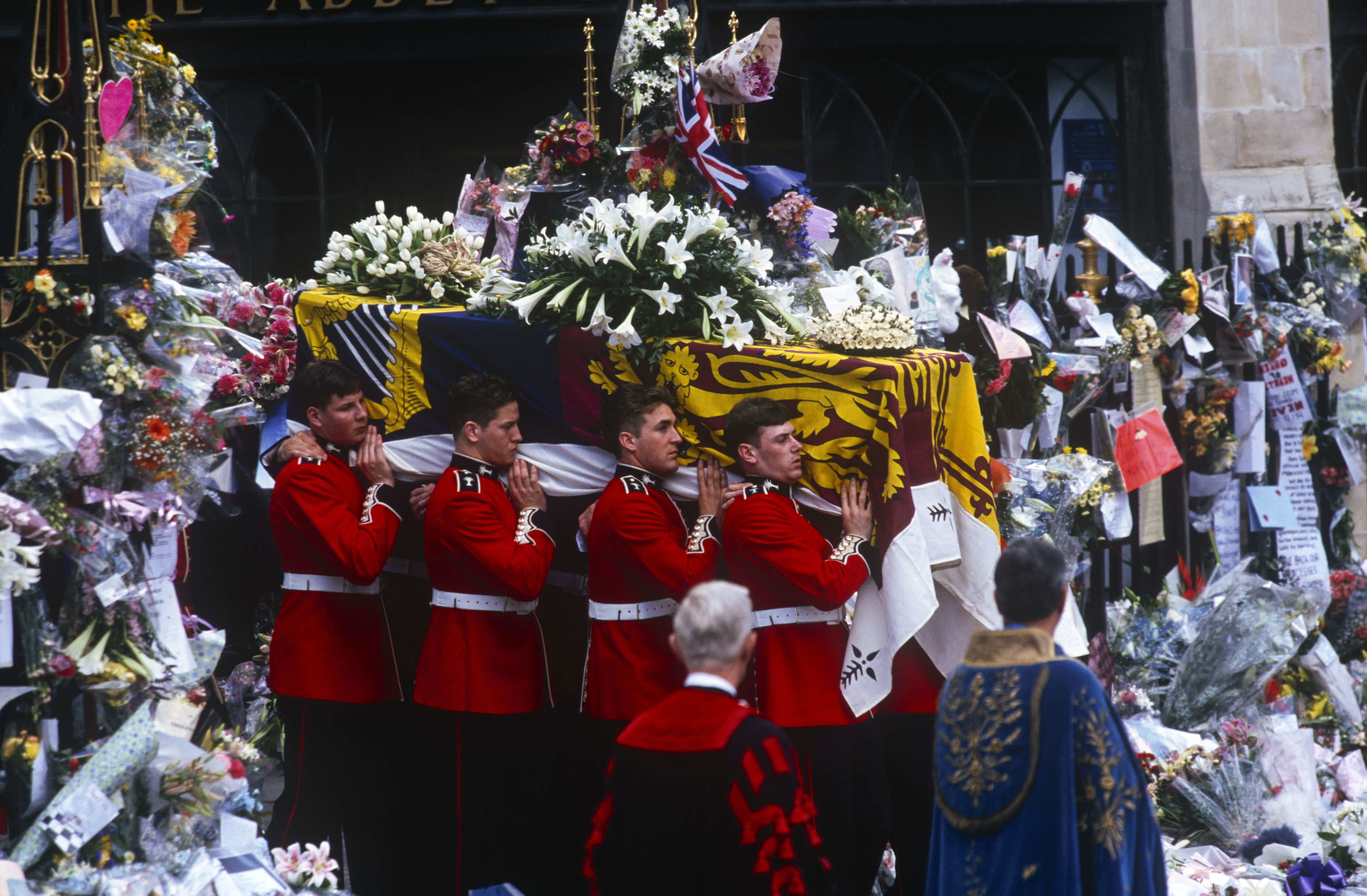 <p>Guardsmen of the Prince of Wales Company of the Welsh Guards carried Princess Diana's casket into Westminster Abbey in London during her funeral on Sept. 6, 1997. </p><p>The coffin was draped with the Royal Standard and topped with floral arrangements from Diana's sons, Prince William and Prince Harry, and brother, Earl Spencer. </p><p>She was buried on an island in an oval lake at Althorp House, the Spencer family estate in Northamptonshire, England. According to her former butler Paul Burrell, her brother removed the Royal Standard before she was buried at their childhood home and replaced it with the Spencer family flag.</p>