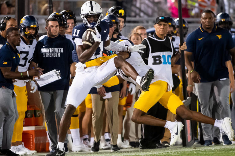 Penn State wide receiver Malik McClain (11) is pushed out of bounds after making a catch against West Virginia at Beaver Stadium September 2, 2023, in State College.