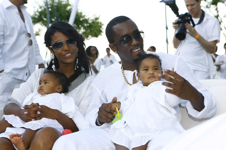 Diddy and Kim Porter pose with their twin daughters, D'Lila Star Combs and Jessie James Combs. (Mat Szwajkos/CP/Getty Images for CP)