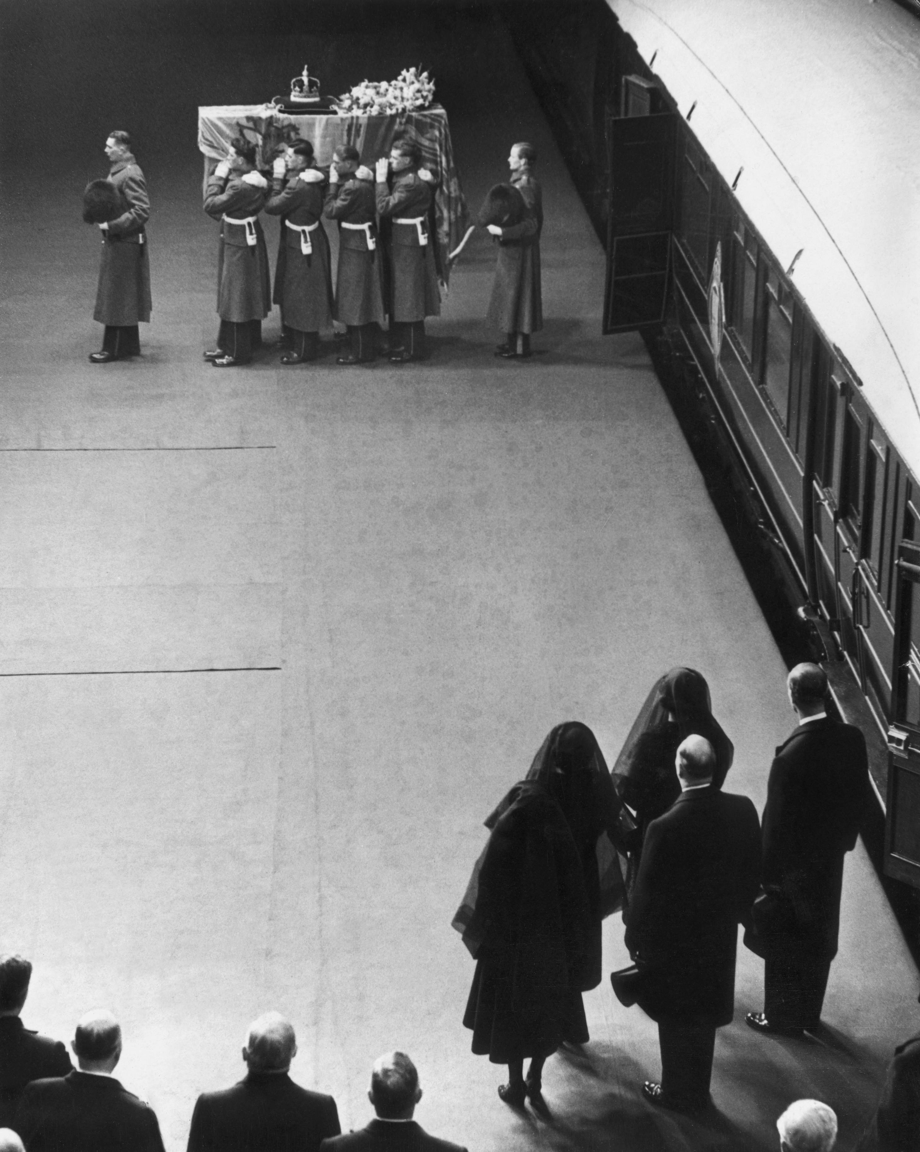 <p>On Feb. 11, 1952, newly widowed Queen Elizabeth (who took the name Queen Elizabeth the Queen Mother), daughters Queen Elizabeth II -- the new monarch -- and Princess Margaret and son-in-law Prince Philip watched as King George VI's coffin was carried from a train before traveling to Westminster Hall in London where he lay in state for several days before being taken to Windsor, England, for his funeral at St. George's Chapel at Windsor Castle on Feb. 15. </p><p>King George VI -- who was previously known as Prince Albert, Duke of York before he took the throne following his brother King Edward VIII's abdication -- died on Feb. 6, 1952, at Sandringham House in Norfolk, England, from a blood clot after years of ill health including a lung cancer diagnosis.</p>