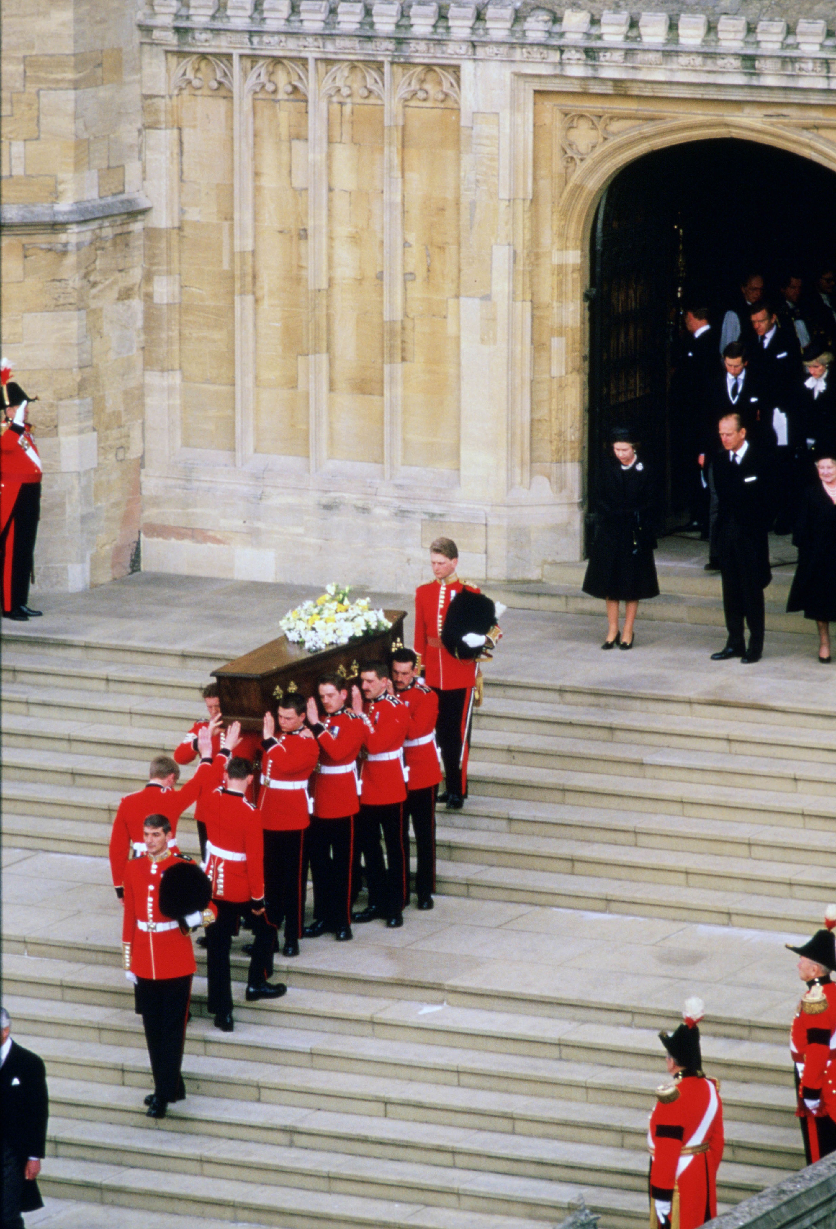 <p>Queen Elizabeth II, Prince Philip, Prince Charles (now Kings Charles III) and Princess Diana are seen on the steps of St. George's Chapel at Windsor Castle during the April 29, 1986, funeral of the Duchess of Windsor -- who's perhaps better known as the former Wallis Simpson, the American widow of the Duke of Windsor, who was briefly King Edward VIII.</p>