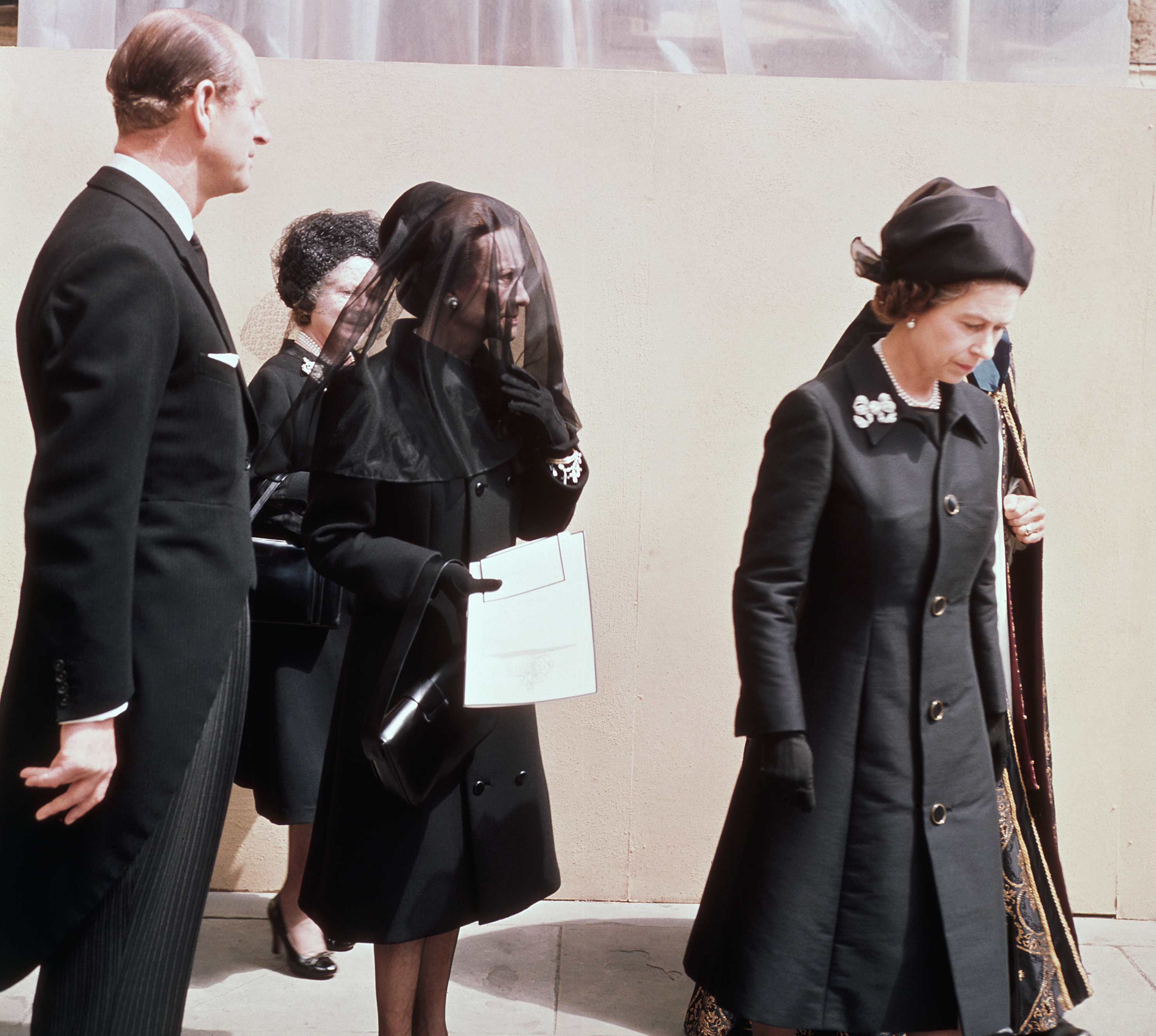 <p>The Duchess of Windsor -- the twice-divorced American for whom King Edward VIII gave up his throne and became the Duke of Windsor -- walked from his funeral service at St. George's Chapel at Windsor Castle with Queen Elizabeth II, Prince Philip and Queen Elizabeth the Queen Mother on June 5, 1977. </p><p>It was the former Wallis Simpson's first and last public appearance with the royal family in England since she and her husband were exiled following his abdication. She flew home to Paris immediately after the burial.</p>
