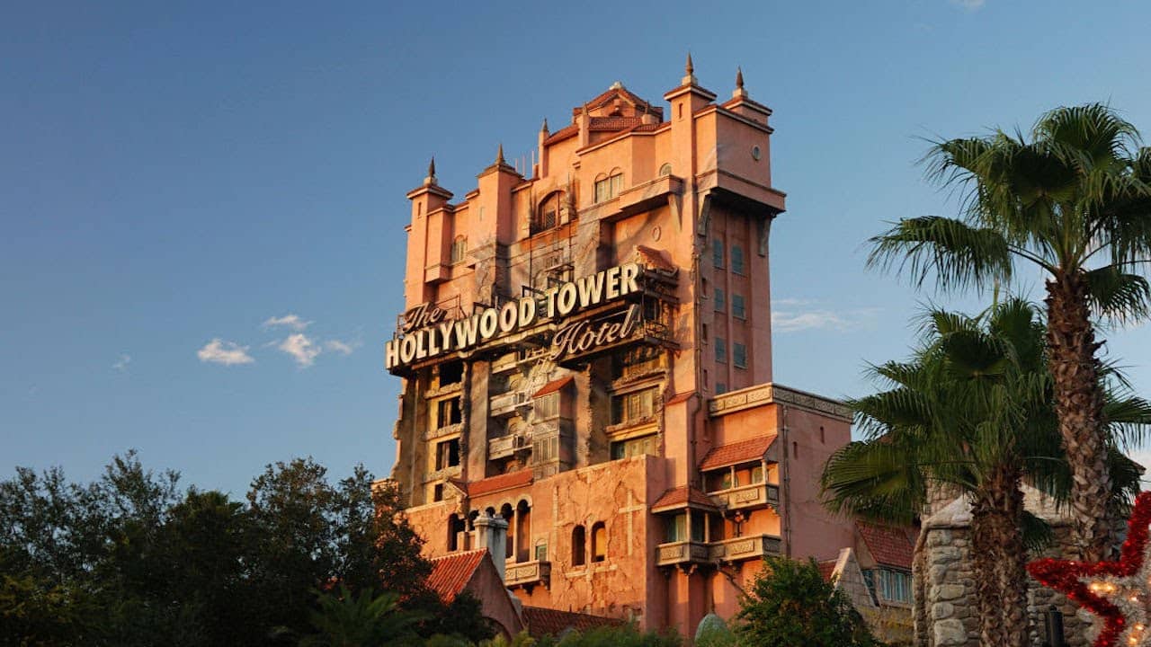 <p>Taking inspiration from Rod Serling’s legendary sci-fi/horror anthology, the Tower of Terror takes guests into the heart of <em>The</em> <em>Twilight Zone</em>, building a singular experience from the moment you lay eyes on the dilapidated hotel settled at the end of <a href="https://ontheroadwithsarah.com/shows-to-see-in-hollywood-studios-at-disney-world/">Hollywood Studios</a>’ Sunset Boulevard.</p><p>From that ominous first sight onward, the Tower of Terror is an attraction like no other, with guests winding their way through a foreboding, once extravagant hotel now abandoned for decades, boarding a service elevator that travels through the hotel, and dropping guests straight into the Fifth Dimension. The impressive queue, the numerous nods to <em>Twilight Zone</em> episodes, and randomized drops in the dark all make this a must-ride, but the atmosphere of this attraction makes it so distinct.</p><p>From the moment the hotel comes into view until exiting a drop elevator, it feels like travelers landed in a <em>Twilight Zone </em>episode, right down to the period music, the minimal lighting, and Rod Serling himself (through clever editing) providing introductory narration as riders prepare to hop on an elevator.</p>