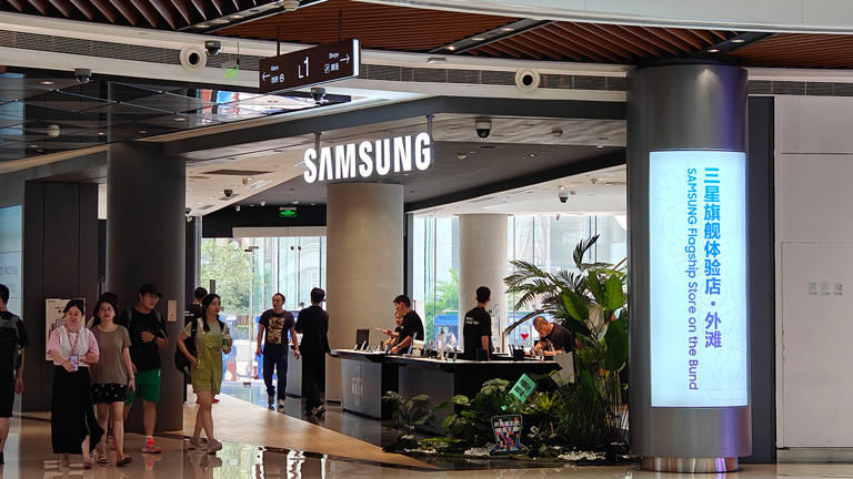 Customers and pedestrians inside and outside the Samsung flagship store on Nanjing Road Pedestrian Street in Shanghai on Sept. 4, 2023. Costfoto/NurPhoto via Getty Images