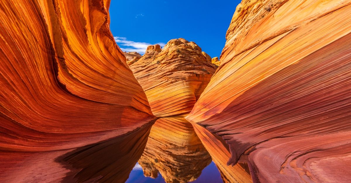<p> Nestled within the Paria Canyon-Vermilion Cliffs Wilderness, the Wave is a surreal sandstone formation that attracts hikers from around the world.  </p> <p> Access is limited to 64 people per day, requiring a permit obtained through a lottery system. Hikers should prepare to navigate a challenging landscape and bring plenty of water. </p>