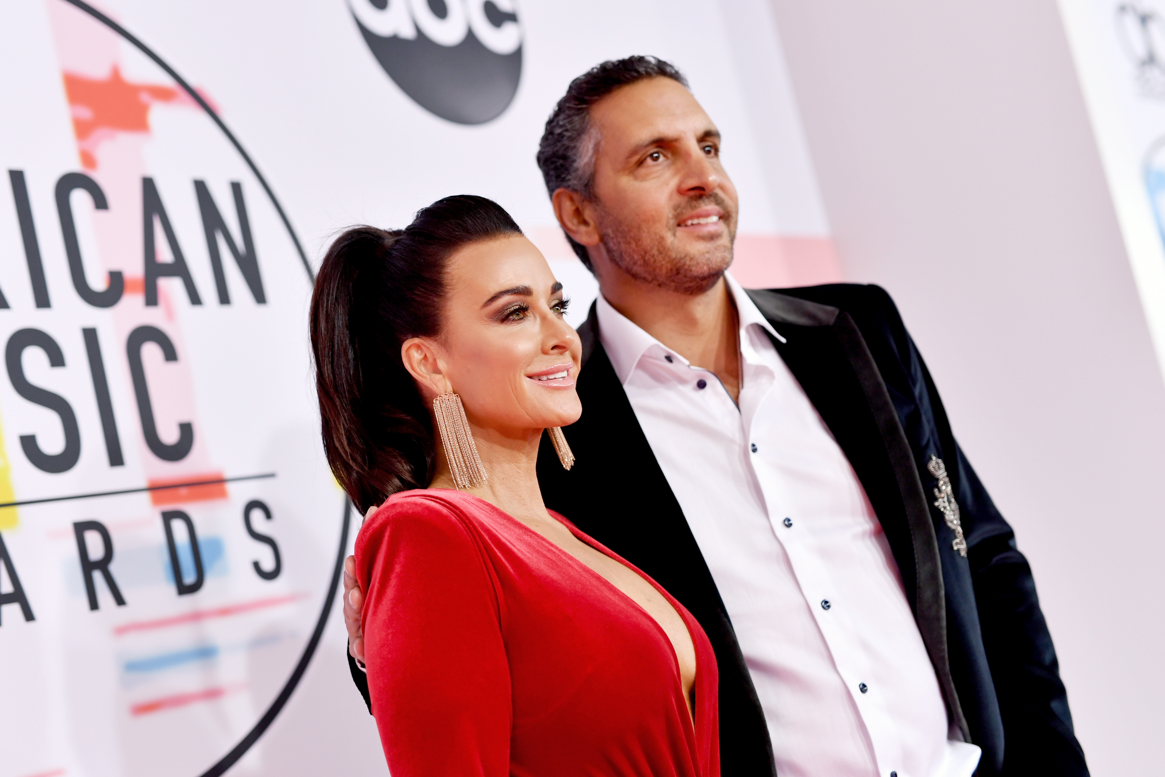 <p><span>"The Real Housewives of Beverly Hills" star Kyle Richards and husband Mauricio Umansky, the founder and CEO of high-end real estate brokerage The Agency, opened up to </span><a href="https://www.theknot.com/content/kyle-richards-marriage">The Knot</a><span> in November 2021 about <a href="https://www.wonderwall.com/celebrity/couples/tk-plus-more-celeb-love-news-520063.gallery?photoId=1035299">how they met nearly three decades earlier</a> at a Hollywood nightclub when he mistook her for Demi Moore's sister. "He worked up the courage to come over and say hello, thinking that I was her sister," Kyle recalled. Chimed in her hubby, "I figured if I couldn't get Demi Moore, I could try to get her sister!" The duo then agreed that the real estate mogul "got something way better" with Kyle. </span></p><p><span>"Other than the fact that she is absolutely gorgeous, she has an amazing soul. She's an amazing person. And quite honestly, the fact that she already had a daughter [Farrah, from her first marriage], it made dating a lot more important," Mauricio explained. "I had to take it much more seriously because I was responsible for a woman with a daughter. I also got insight into the way that she was as a mom and how good of a mom she was. And that gave me insight into the future and what it would look like." Added the mother of four, "The moment we started dating, I just felt like he was the one." </span></p><p><a href="https://www.wonderwall.com/celebrity/couples/long-lasting-reality-tv-romance-422871.gallery?photoId=1035299">The long-term couple</a><span> also dished on their engagement, revealing that Mauricio popped the question at a restaurant in Santa Monica and gave Farrah her own engagement ring because he "had to ask her to marry me too" — and wedding, which they moved up three months so Kyle's dress "would still fit" when she unexpectedly got pregnant with daughter Alexia.</span></p><p>In June 2023, People magazine reported that <a href="https://www.wonderwall.com/celebrity/couples/what-went-wrong-kylie-jenner-and-travis-scott-are-off-again-following-late-2022-cheating-allegations-more-splits-of-2023-691804.gallery?photoId=758809">Kyle and Mauricio separated</a>.</p>