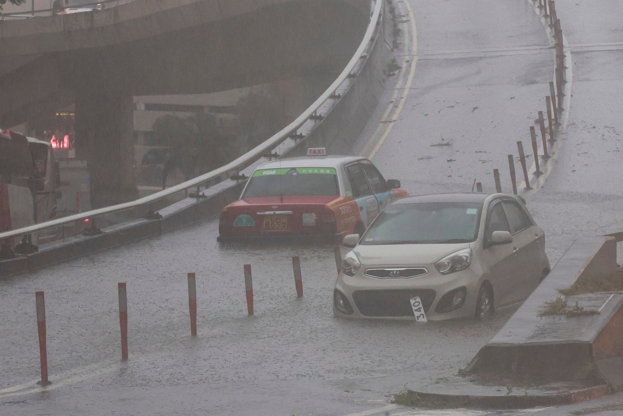 Hong Kong wakes to chaos in urban areas as downpour under black ...