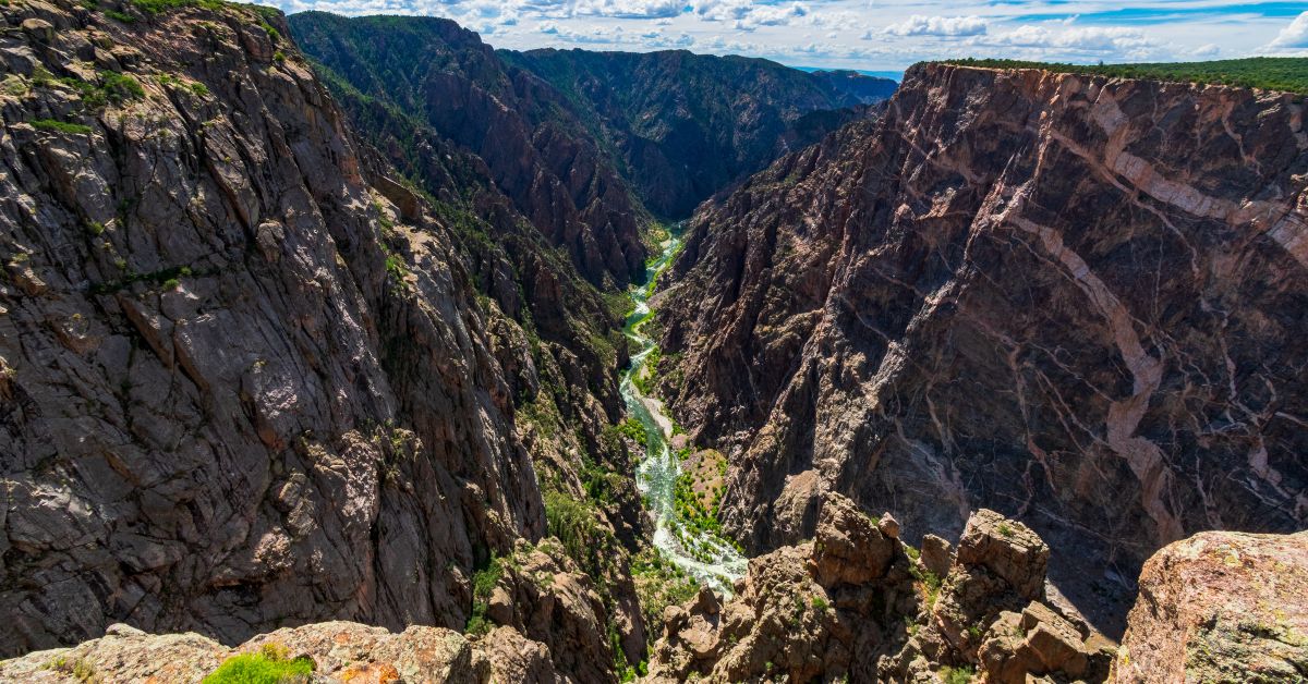 <p> Visiting Grand Canyon National Park is on many people’s bucket list, so the park receives a major influx of sightseers every year — 4.73 million in 2022. You can expect it to be packed in the warmer months.  </p> <h3>Go here instead: Black Canyon Of The Gunnison National Park </h3> <p> However, the Grand Canyon isn’t the only stunning canyon and registered national park you can visit. If you are willing to travel to Colorado, you can see the Black Canyon Of The Gunnison National Park.  </p> <p> This park has deep canyons that are just as gorgeous as its more famous counterpart, but less packed with tourists. There’s also a river running through the canyons that you can hike to, fish in, or enjoy by kayak. </p> <p> Black Canyon Of The Gunnison also earns praise for its dark and clear skies, where you can see as many as 5,000 stars at night. </p> <p>  <a href="https://financebuzz.com/ways-to-travel-more?utm_source=msn&utm_medium=feed&synd_slide=4&synd_postid=13335&synd_backlink_title=6+ways+to+build+a+life+where+you+can+travel+any+time+you+want&synd_backlink_position=5&synd_slug=ways-to-travel-more">6 ways to build a life where you can travel any time you want</a>  </p>