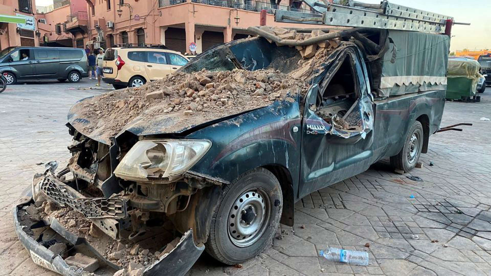 A damaged vehicle is pictured in the historic city of Marrakech on Saturday. - Abdelhak Balhaki/Reuters
