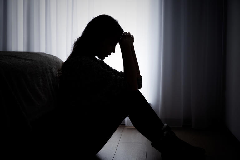A stock photo shows a woman suffering from depression. A new study found that lifestyle factors are very important in reducing the risk of the mental illness.