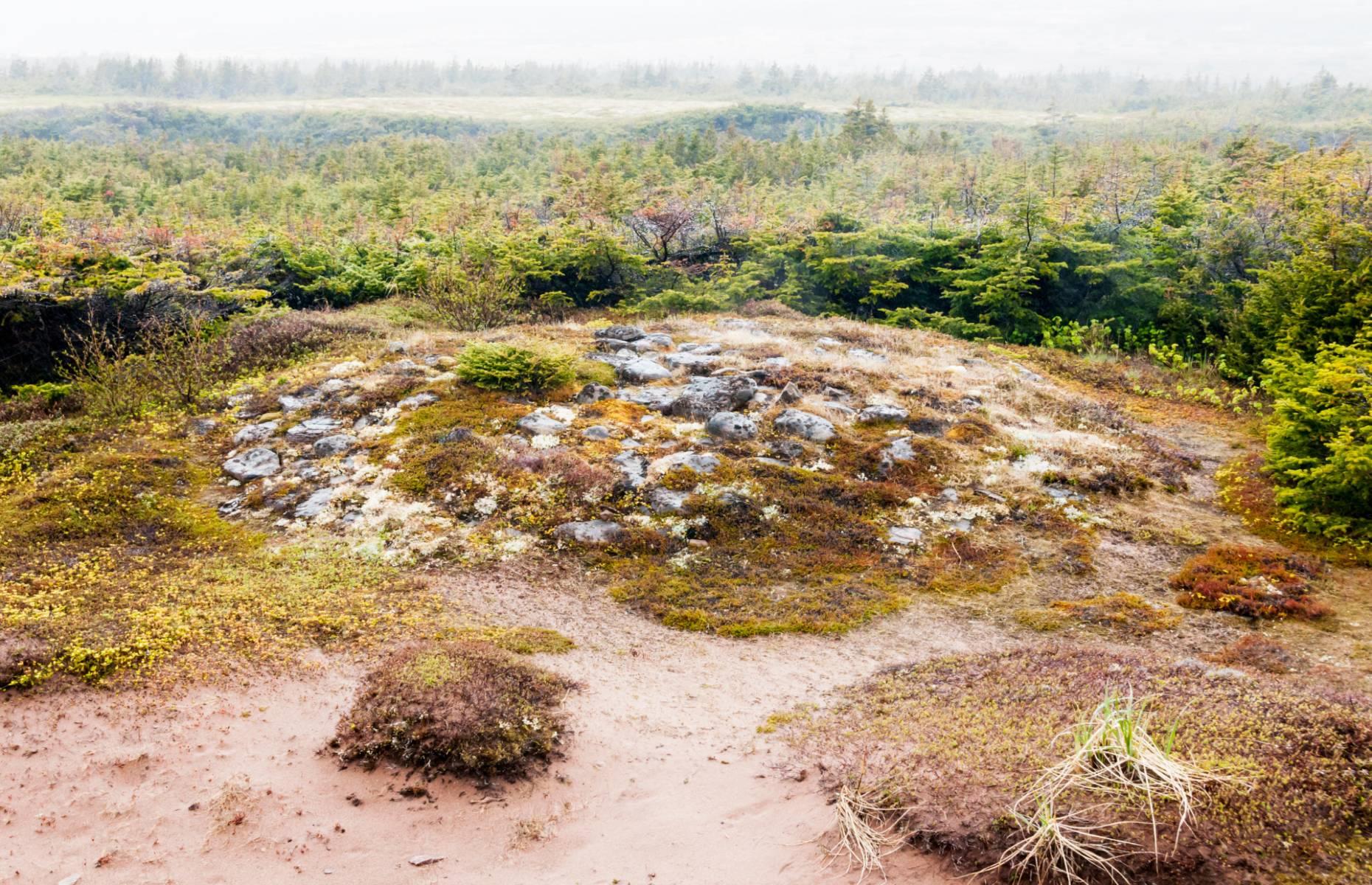 <p>This burial mound on the coast of southern Labrador is the oldest known funerary monument in North America, marking the grave of an adolescent boy who belonged to the Maritime Archaic people and died around 5,500 BC. The body was covered with red ochre, wrapped in birch bark and placed in a large pit flanked by fires. Walrus tusks, harpoon heads, paint stones and a bone whistle were then interred with him, beneath a 26-foot-wide (8m) mound that probably took the local tribe at least a week to create. Archaeologists excavated the site in 1974 before restoring the mound’s original shape for modern-day visitors to admire.</p>